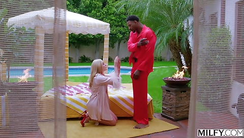 Sexy young blonde in black lingerie and government